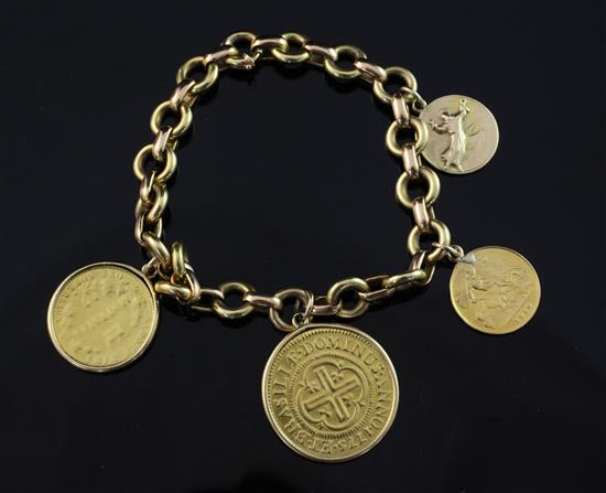 A gold bracelet hung with three coins and a medallion including a 1910 gold half sovereign, 8.25in.